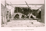 View of weavers at loom